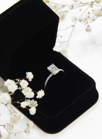 Custom white gold diamond engagement ring in box by NYC jeweler Clarity by Claire